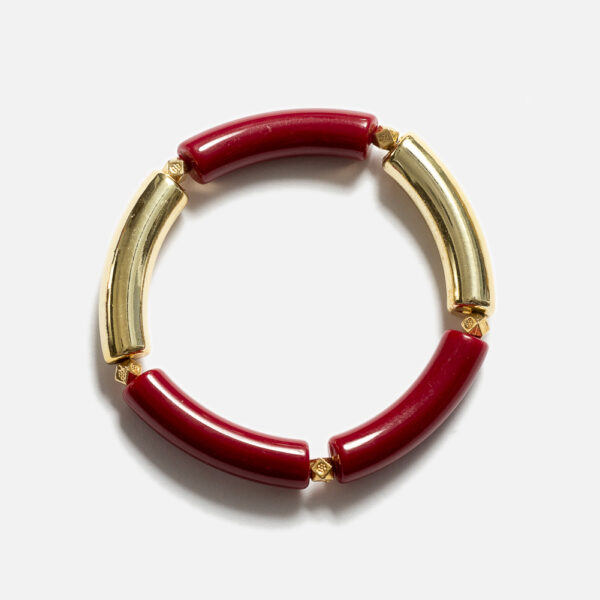 Bracelet jonc élastique composé de tubes en acrylique et de composants dorés à l'Or fin 24 carats. Il se porte seul ou à plusieurs, à marier à l'infini !